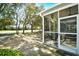 Relaxing screened-in porch with outdoor seating, offering views of the yard and surrounding green spaces at 6095 Catalina Dr. # 1614, North Myrtle Beach, SC 29582