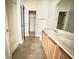 Bathroom featuring double sink vanity with wood cabinets and tile flooring at 721 Painted Bunting Ct. # C, Murrells Inlet, SC 29576