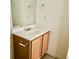 Powder room with single sink vanity, laminate countertops, and oak colored cabinets at 721 Painted Bunting Ct. # C, Murrells Inlet, SC 29576