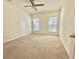 Spacious bedroom featuring carpet flooring, neutral walls, and a ceiling fan with light at 721 Painted Bunting Ct. # C, Murrells Inlet, SC 29576