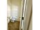 Compact powder room features tile flooring, a toilet, and a sink at 721 Painted Bunting Ct. # C, Murrells Inlet, SC 29576