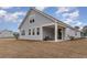 Inviting home with a covered patio area and light-colored siding at 729 Choctaw Dr., Conway, SC 29526