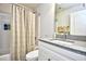 Well-lit bathroom with a shower-tub combination and a granite countertop vanity at 753 Moen Pl. # B, Myrtle Beach, SC 29577