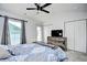 Bedroom featuring carpet, ceiling fan, closet doors, and a door leading outside at 753 Moen Pl. # B, Myrtle Beach, SC 29577