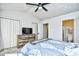 Bedroom featuring carpet, ceiling fan, closet doors, and an ensuite bathroom at 753 Moen Pl. # B, Myrtle Beach, SC 29577