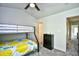 Neutral-toned bedroom with a ceiling fan, bunk bed, carpet, and a black dresser at 753 Moen Pl. # B, Myrtle Beach, SC 29577