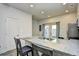 View of kitchen island with granite countertops, stainless steel appliances and space for barstool seating for two at 753 Moen Pl. # B, Myrtle Beach, SC 29577