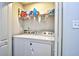 Functional laundry room with a washer, dryer, and storage shelf at 753 Moen Pl. # B, Myrtle Beach, SC 29577