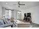 Bright living room with hardwood floors, recessed lighting, modern ceiling fan and neutral-colored furnishings at 753 Moen Pl. # B, Myrtle Beach, SC 29577