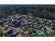 Aerial shot showcasing the home's location near a pond within a wooded community at 80-2 Knight Circle # 2, Pawleys Island, SC 29585