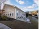 Backyard patio with chairs, manicured lawn, and view of the house at 80-2 Knight Circle # 2, Pawleys Island, SC 29585