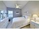 Cozy bedroom with a ceiling fan, a window with blinds, and coastal decor at 80-2 Knight Circle # 2, Pawleys Island, SC 29585