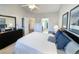 Spacious bedroom featuring a queen bed with bedside tables and a walk-through to the bathroom at 80-2 Knight Circle # 2, Pawleys Island, SC 29585