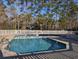 Sparkling community pool surrounded by a white picket fence and mature trees at 80-2 Knight Circle # 2, Pawleys Island, SC 29585