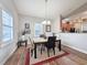 Bright dining area featuring a modern chandelier and a clear view into the kitchen at 80-2 Knight Circle # 2, Pawleys Island, SC 29585