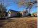 Exterior shot of home showing well-maintained landscape and two car garage at 80-2 Knight Circle # 2, Pawleys Island, SC 29585