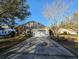 Charming home featuring a long drive, two-car garage, and a mix of brick and siding at 80-2 Knight Circle # 2, Pawleys Island, SC 29585
