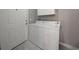 Laundry area with a white washer and dryer unit near the entry door at 80-2 Knight Circle # 2, Pawleys Island, SC 29585