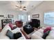 Bright living area featuring vaulted ceiling, fan, and lots of natural light at 80-2 Knight Circle # 2, Pawleys Island, SC 29585