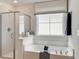 Relaxing bathroom featuring a soaking tub, a separate shower, and a large bright window at 918 Agostino Dr., Myrtle Beach, SC 29579