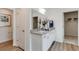 Bright bathroom with double sinks, granite countertops, and a door leading to a walk-in closet at 918 Agostino Dr., Myrtle Beach, SC 29579