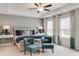 Serene main bedroom showcasing a tray ceiling, accent wall, and two large windows at 918 Agostino Dr., Myrtle Beach, SC 29579