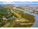 Stunning aerial view of golf course and coastal community near waterway and the ocean at 921 Heshbon Dr., North Myrtle Beach, SC 29582
