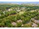 Aerial view of a neighborhood showcasing lush tree cover and a golf course at 921 Heshbon Dr., North Myrtle Beach, SC 29582