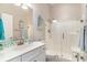 Bright bathroom featuring a vanity, sink, toilet, and glass enclosed shower at 921 Heshbon Dr., North Myrtle Beach, SC 29582