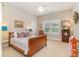 Inviting bedroom featuring a wooden bed frame, neutral walls, and a window with natural light at 921 Heshbon Dr., North Myrtle Beach, SC 29582