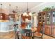 A formal dining area is showcased with wood furniture and decor, adjacent to the kitchen and living area at 921 Heshbon Dr., North Myrtle Beach, SC 29582