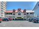 Beach house with ground-level parking, charming architectural details, and outdoor living spaces at 921 Heshbon Dr., North Myrtle Beach, SC 29582