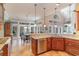 A lovely kitchen featuring stainless appliances, granite countertops, and an adjacent breakfast area with many windows at 921 Heshbon Dr., North Myrtle Beach, SC 29582