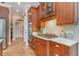 Gourmet kitchen with custom cabinetry, granite countertops, stainless steel appliances, and tile flooring at 921 Heshbon Dr., North Myrtle Beach, SC 29582
