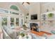 Bright living room with a fireplace, vaulted ceilings, built-in shelving and plenty of natural light at 921 Heshbon Dr., North Myrtle Beach, SC 29582