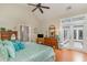 The main bedroom features wood floors, a comfortable bed with nice pillows, and access to a private outdoor area at 921 Heshbon Dr., North Myrtle Beach, SC 29582