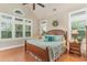 The main bedroom offers ample natural light with large windows and a vaulted ceiling creating a luxurious retreat at 921 Heshbon Dr., North Myrtle Beach, SC 29582