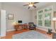 This office features wood floors, plantation shutters, and a comfortable chair for a productive workspace at 921 Heshbon Dr., North Myrtle Beach, SC 29582