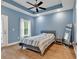 Cozy bedroom with tray ceiling, ceiling fan, and ample natural light at 940 Jackline Place # 202, Murrells Inlet, SC 29576