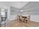 Dining room with stylish lighting, wood floors, and access to the kitchen at 940 Jackline Place # 202, Murrells Inlet, SC 29576