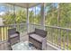 Relaxing screened porch with comfortable seating and wooded view at 940 Jackline Place # 202, Murrells Inlet, SC 29576