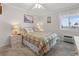 Inviting primary bedroom with a plush queen bed, soft lighting and closet at 9660 Shore Dr. # 117, Myrtle Beach, SC 29572