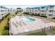 Community pool with lounge chairs at 9660 Shore Dr. # 117, Myrtle Beach, SC 29572