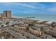 Stunning aerial view of oceanfront condos and a pier, with RV parking and a view of the beach and blue ocean at 9661 Shore Dr. # A-21, Myrtle Beach, SC 29572