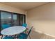 Comfortable condo balcony featuring a small table and chairs to enjoy outdoor living at 9661 Shore Dr. # A-21, Myrtle Beach, SC 29572