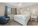 Comfortable bedroom featuring a cozy chair, ceiling fan, and peaceful decor at 9661 Shore Dr. # A-21, Myrtle Beach, SC 29572