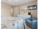 Well-lit bedroom features flat screen tv, a cozy chair, and beach themed decor at 9661 Shore Dr. # A-21, Myrtle Beach, SC 29572
