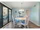 Dining room with a white table and blue chairs in a bright space at 9661 Shore Dr. # A-21, Myrtle Beach, SC 29572