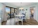 Bright dining room with a white table and chairs near a sliding glass door at 9661 Shore Dr. # A-21, Myrtle Beach, SC 29572