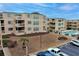 View of condos and landscaping from an elevated point showing pool and parking area at 9661 Shore Dr. # A-21, Myrtle Beach, SC 29572